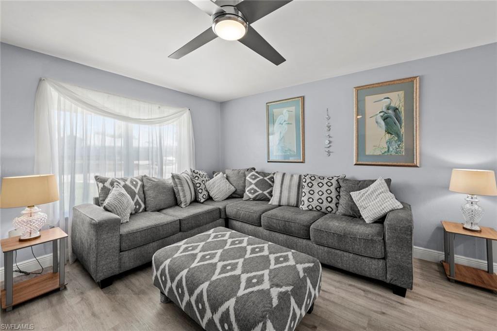 17528 Fuchsia Road Fort Myers, FL 33967 - Photo 12 of 42 a living room with furniture and a large window