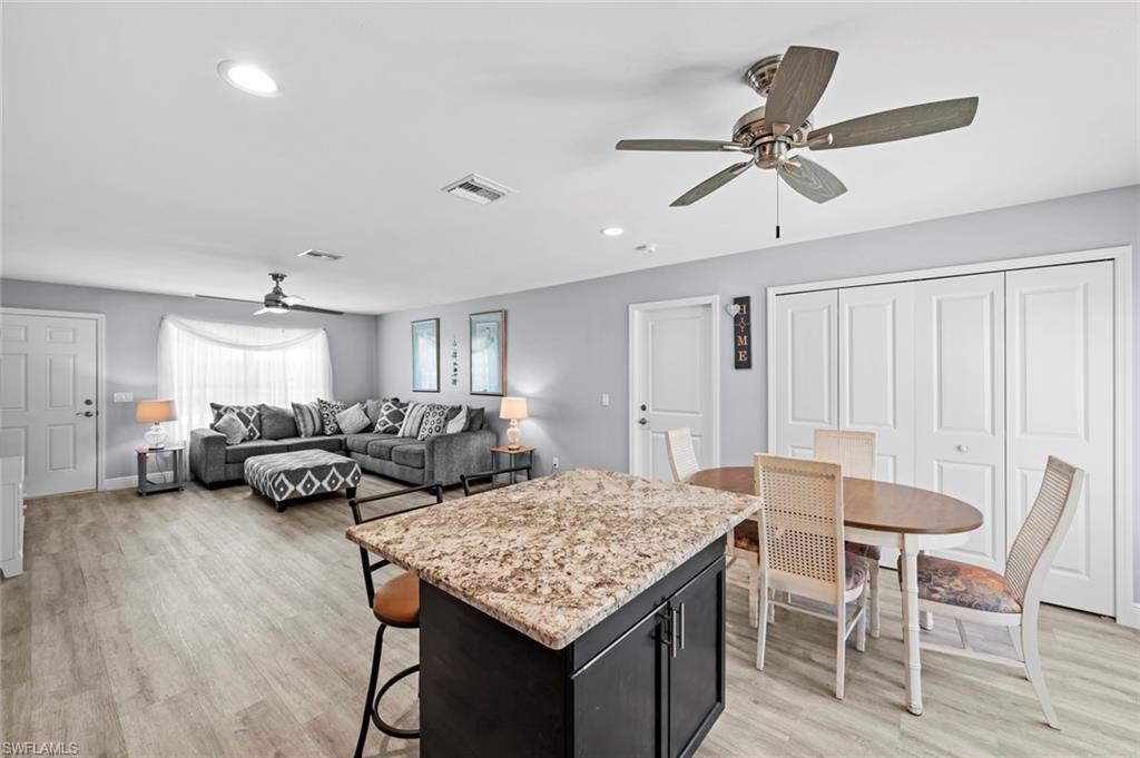 17528 Fuchsia Road Fort Myers, FL 33967 - Photo 20 of 42 a living room with furniture and a wooden floor