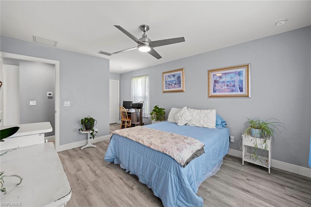 17528 Fuchsia Road Fort Myers, FL 33967 - Photo 23 of 42 a living room with a bed and furniture