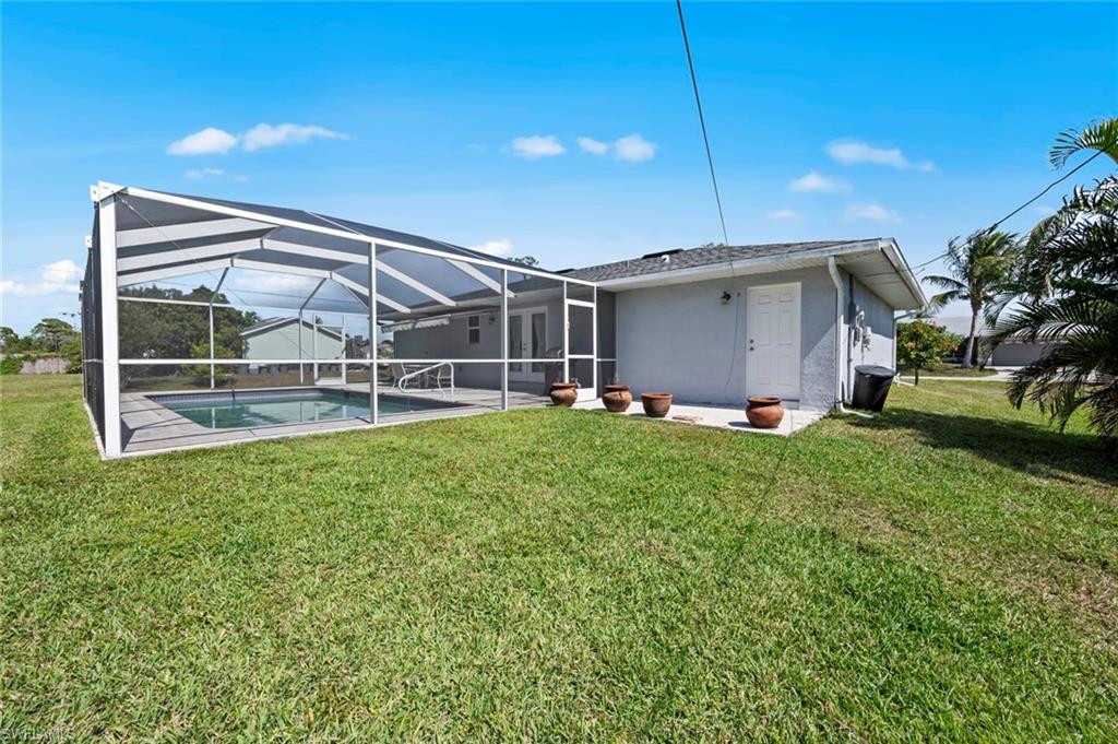 17528 Fuchsia Road Fort Myers, FL 33967 - Photo 39 of 42 a view of a house with backyard and garden