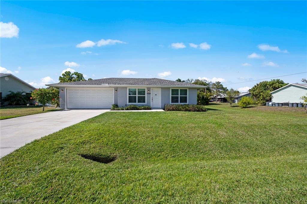 17528 Fuchsia Road Fort Myers, FL 33967 - Photo 41 of 42 a view of a house with a yard