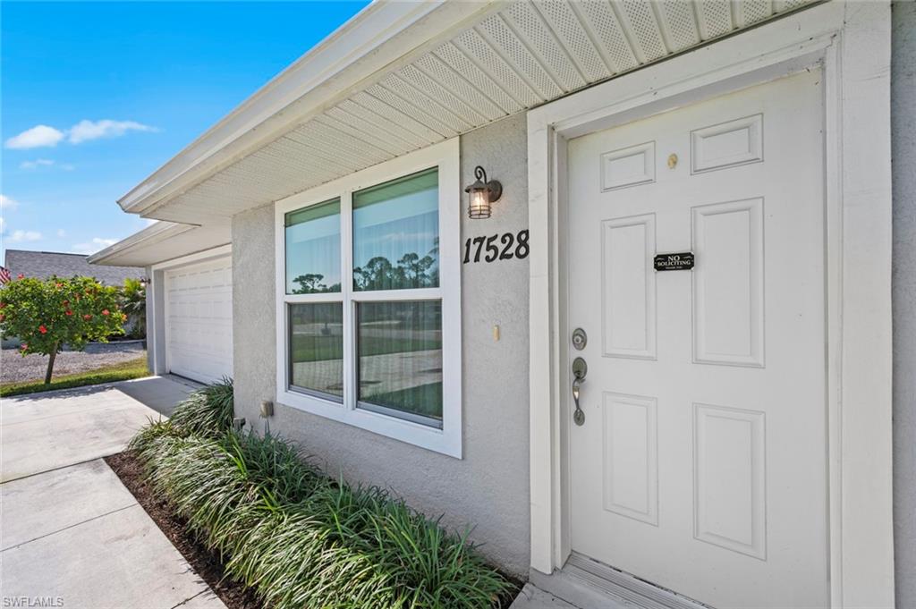 17528 Fuchsia Road Fort Myers, FL 33967 - Photo 42 of 42 front view of a house with a yard