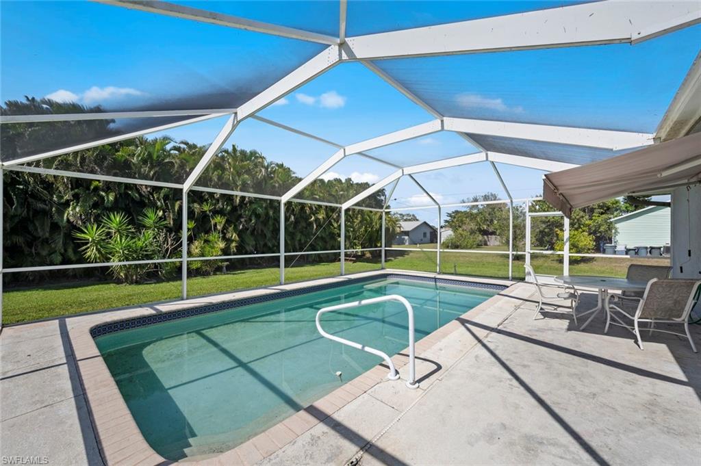 17528 Fuchsia Road Fort Myers, FL 33967 - Photo 5 of 42 a view of a backyard with a patio