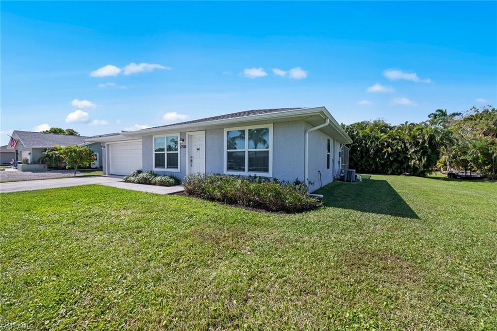 17528 Fuchsia Road Fort Myers, FL 33967 - Photo 8 of 42 a view of an house with backyard space and garden