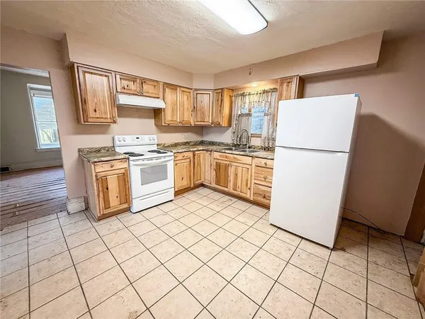 a kitchen with cabinets and steel stainless steel appliances