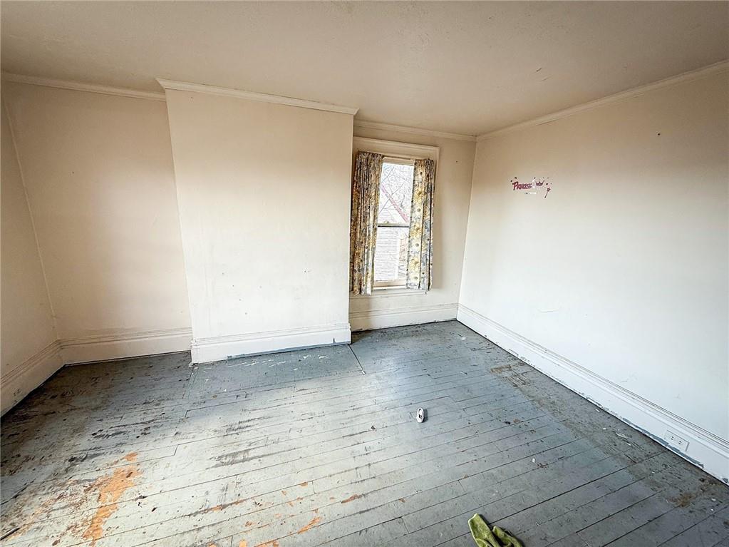 248 East Fulton Street Butler, PA 16001 - Photo 20 of 35 an empty room with wooden floor and windows