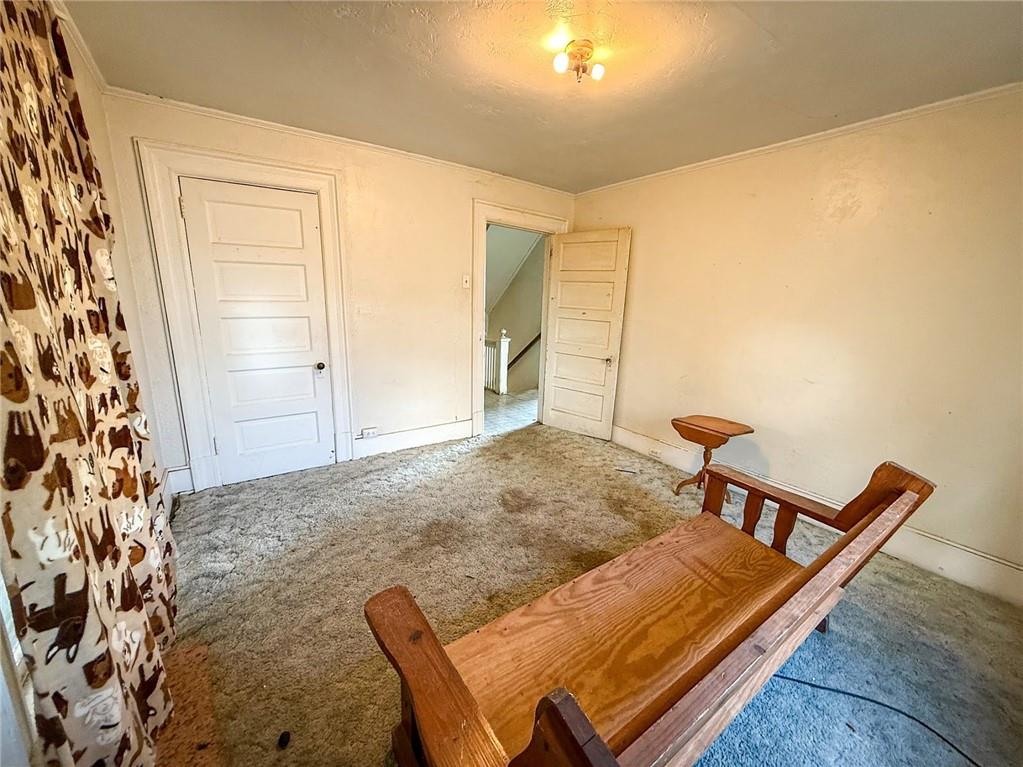 248 East Fulton Street Butler, PA 16001 - Photo 27 of 35 a view of a hallway with two chairs and a potted plant