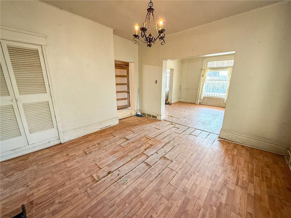 248 East Fulton Street Butler, PA 16001 - Photo 32 of 35 an empty room with wooden floor closet and windows