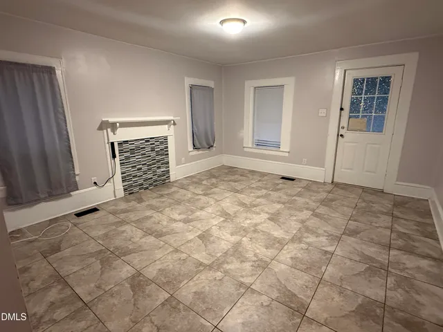 a view of empty room with windows