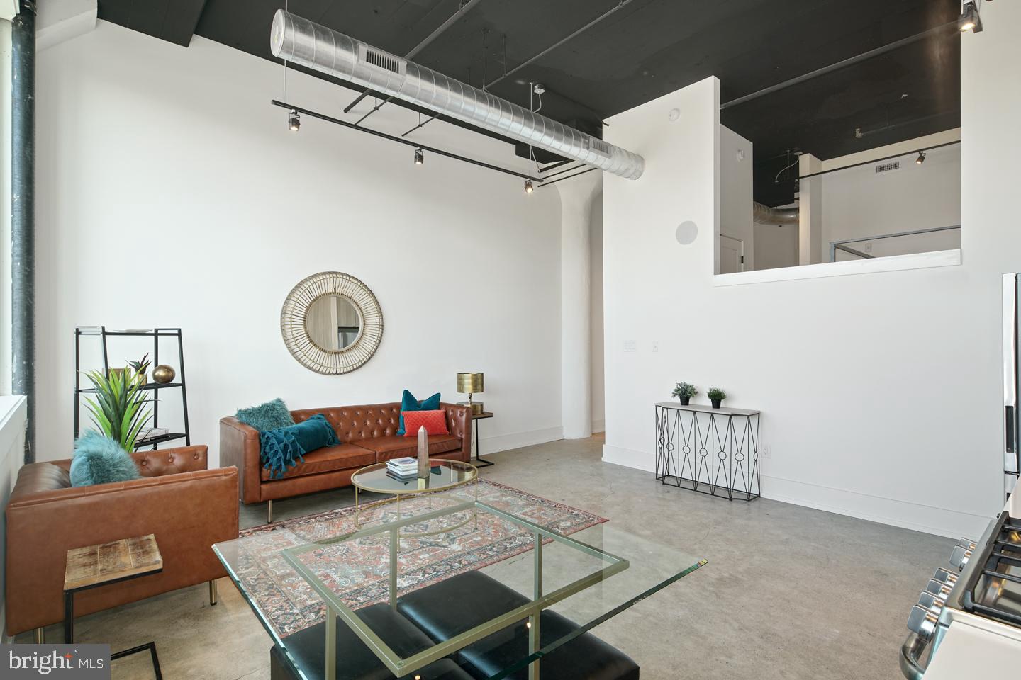 1218 Snyder Avenue, Unit 5 Philadelphia, PA 19148 - Photo 5 of 10 a living room with furniture and a wooden floor