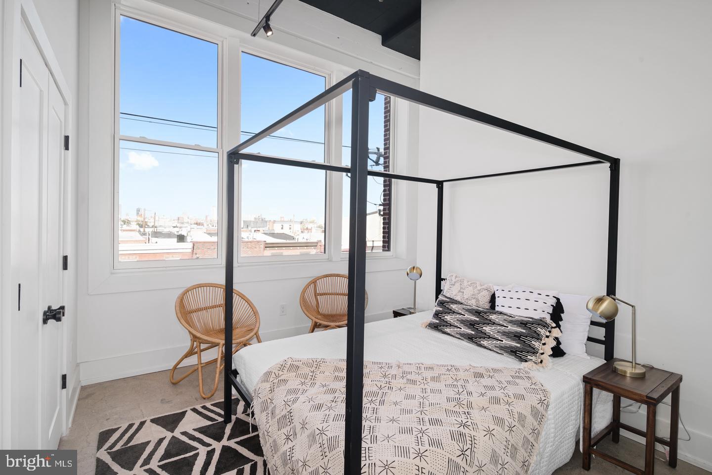 1218 Snyder Avenue, Unit 5 Philadelphia, PA 19148 - Photo 7 of 10 a bed room with furniture and a window