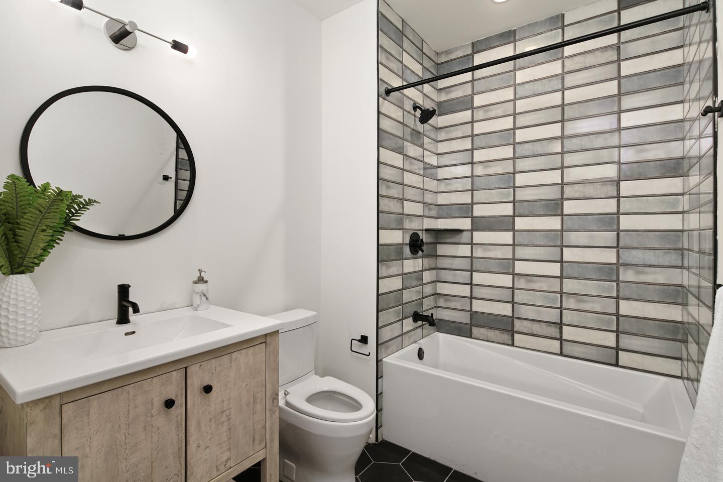 1218 Snyder Avenue, Unit 5 Philadelphia, PA 19148 - Photo 9 of 10 a bathroom with a sink and a mirror