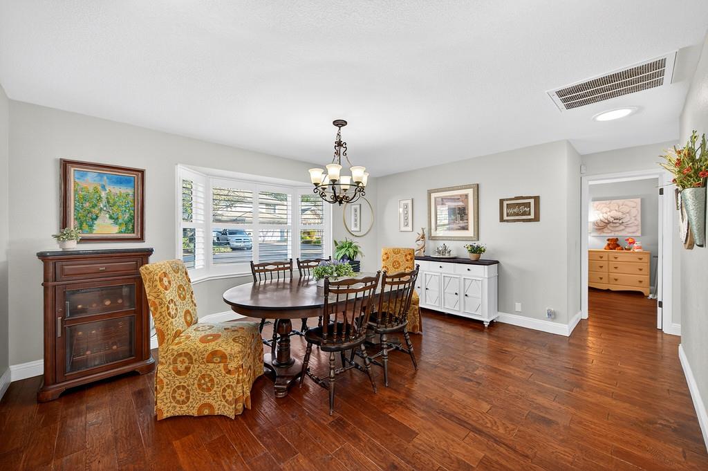 6610 Rio Oso Drive Rancho Murieta, CA 95683 - Photo 11 of 58 a view of a dining room with furniture and wooden floor