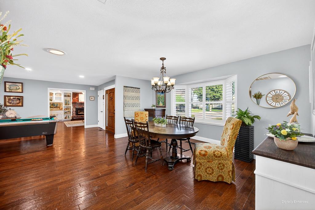 6610 Rio Oso Drive Rancho Murieta, CA 95683 - Photo 12 of 58 a view of a dining room with furniture window and wooden floor