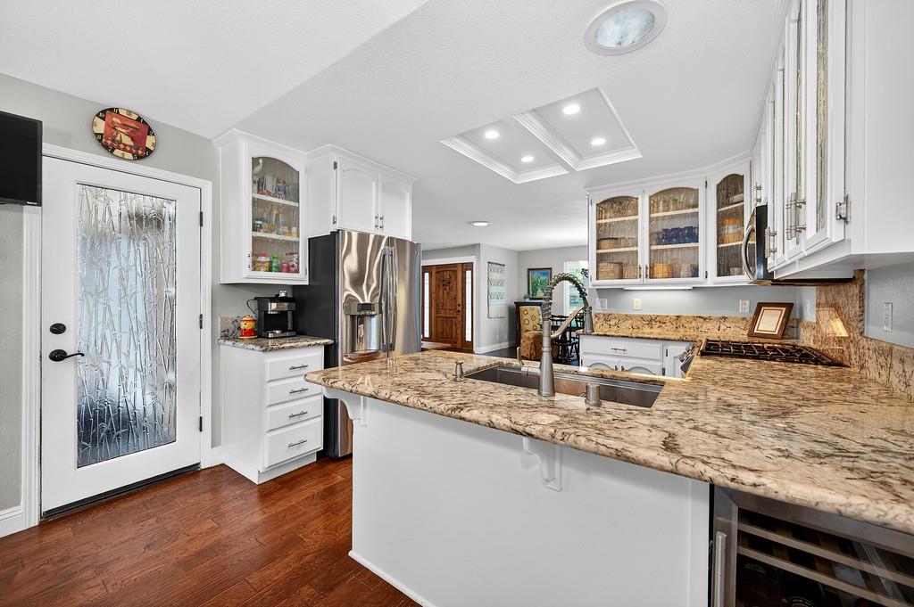 6610 Rio Oso Drive Rancho Murieta, CA 95683 - Photo 20 of 58 a kitchen with stainless steel appliances granite countertop a sink and cabinets