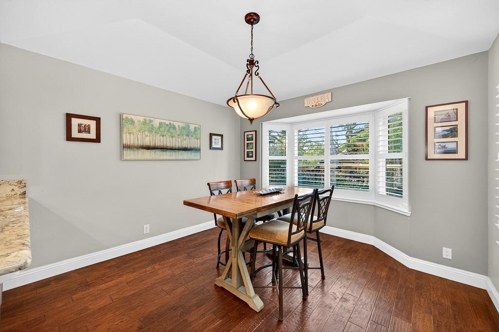 6610 Rio Oso Drive Rancho Murieta, CA 95683 - Photo 23 of 58 a view of a dining room with furniture window and wooden floor