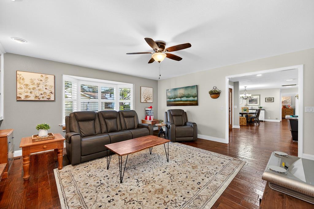 6610 Rio Oso Drive Rancho Murieta, CA 95683 - Photo 24 of 58 a living room with furniture a rug and a table