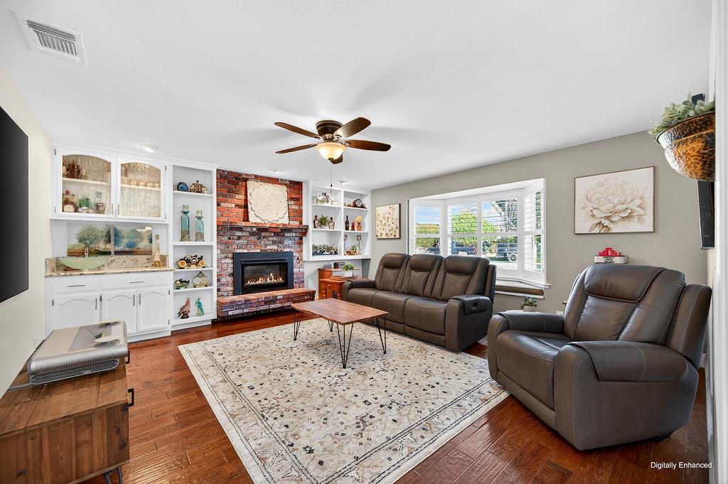 6610 Rio Oso Drive Rancho Murieta, CA 95683 - Photo 25 of 58 a living room with furniture and a fireplace