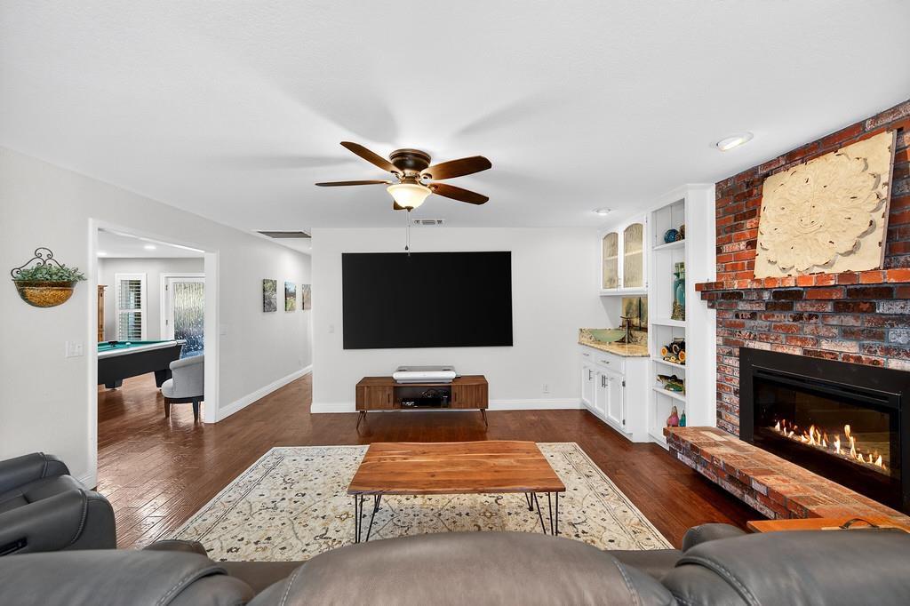 6610 Rio Oso Drive Rancho Murieta, CA 95683 - Photo 26 of 58 a bedroom with furniture and a fireplace