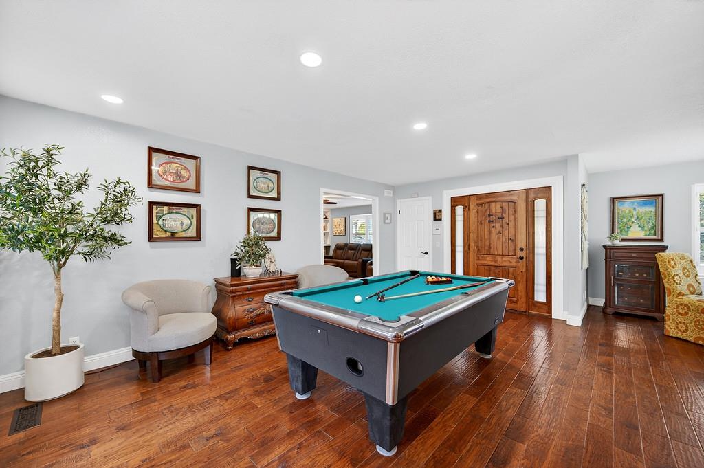 6610 Rio Oso Drive Rancho Murieta, CA 95683 - Photo 29 of 58 a living room with furniture and wooden floor