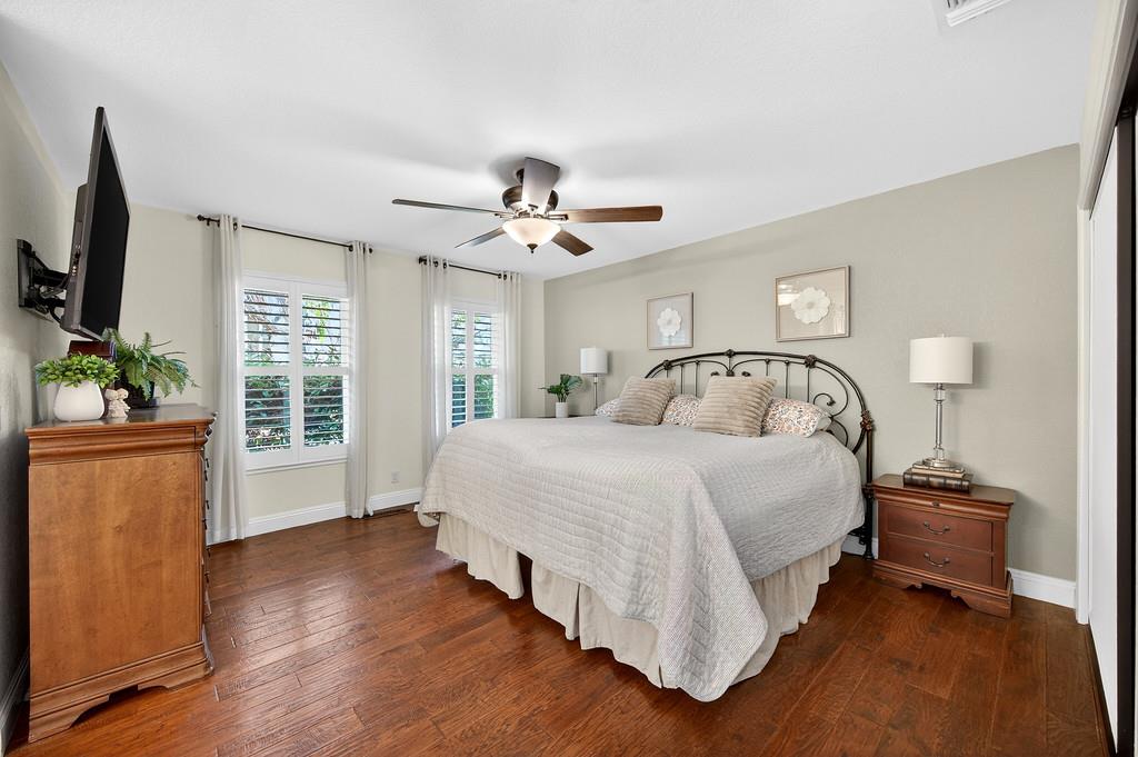 6610 Rio Oso Drive Rancho Murieta, CA 95683 - Photo 30 of 58 a spacious bedroom with a bed and a flat screen television