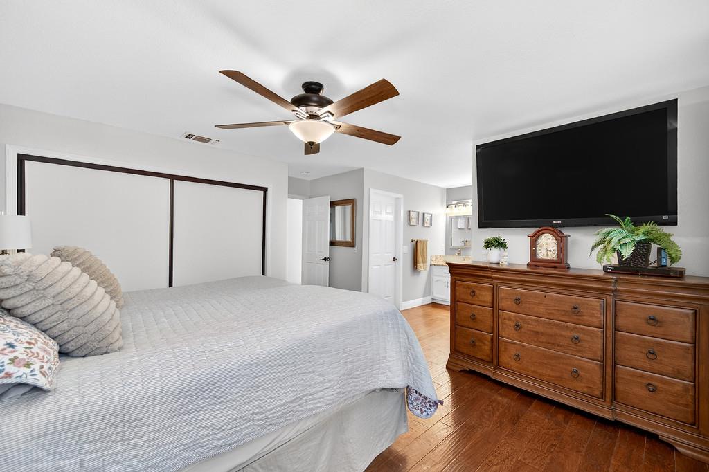 6610 Rio Oso Drive Rancho Murieta, CA 95683 - Photo 33 of 58 a bedroom with a bed and a flat screen tv