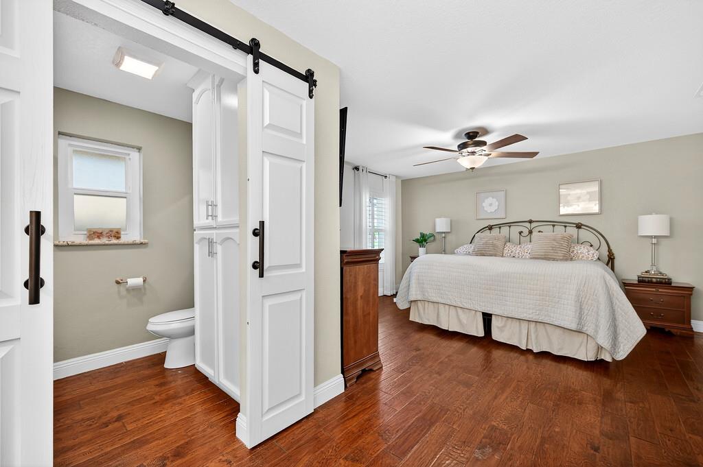 6610 Rio Oso Drive Rancho Murieta, CA 95683 - Photo 34 of 58 a spacious bedroom with a bed and closet