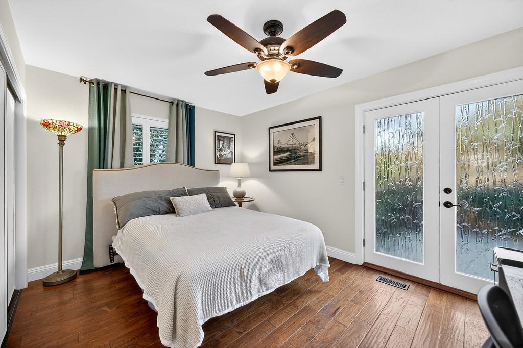 6610 Rio Oso Drive Rancho Murieta, CA 95683 - Photo 45 of 58 a bedroom with a large bed and a large window