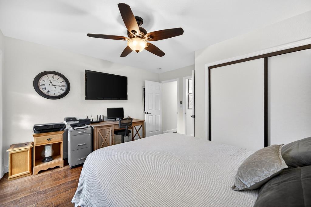 6610 Rio Oso Drive Rancho Murieta, CA 95683 - Photo 47 of 58 a bedroom with a large bed and a flat tv screen