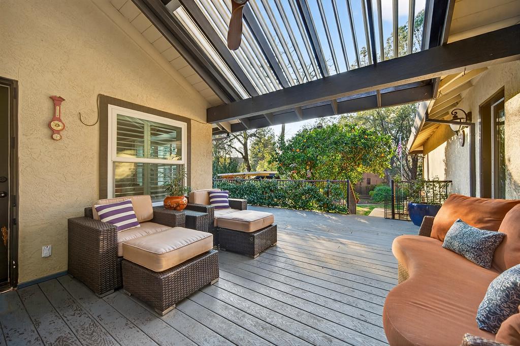 6610 Rio Oso Drive Rancho Murieta, CA 95683 - Photo 52 of 58 a patio with patio couch and wooden floor