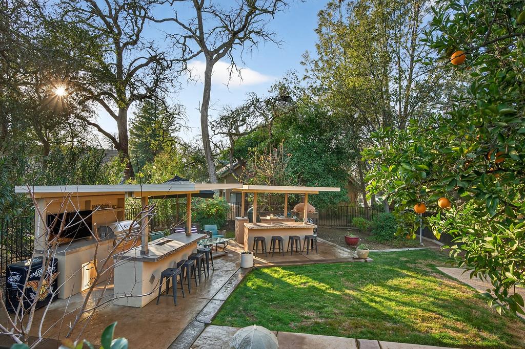 6610 Rio Oso Drive Rancho Murieta, CA 95683 - Photo 55 of 58 a balcony with wooden floor and outdoor seating