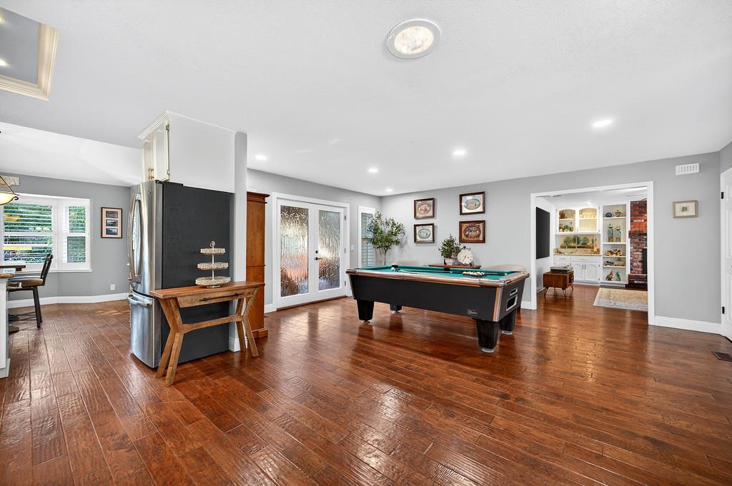 6610 Rio Oso Drive Rancho Murieta, CA 95683 - Photo 7 of 58 a living room with furniture and a wooden floor