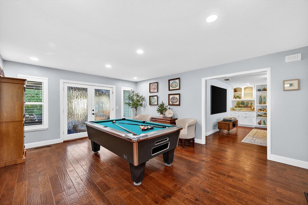 6610 Rio Oso Drive Rancho Murieta, CA 95683 - Photo 8 of 58 a room with furniture pool table wooden floor and windows