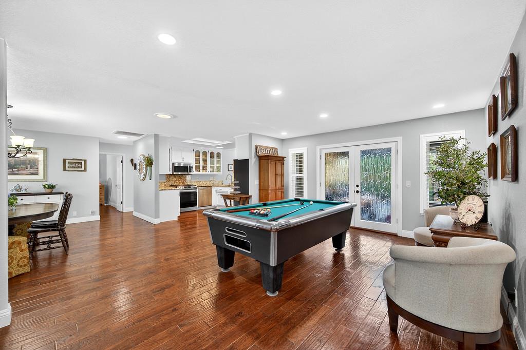 6610 Rio Oso Drive Rancho Murieta, CA 95683 - Photo 9 of 58 a living room with furniture and a wooden floor