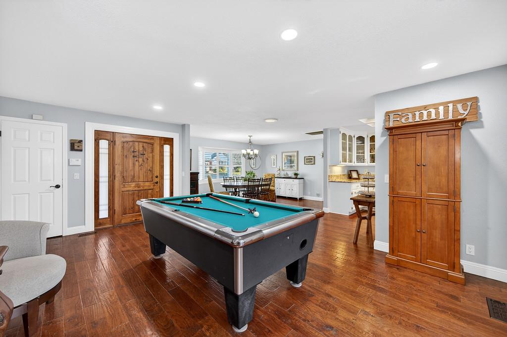 6610 Rio Oso Drive Rancho Murieta, CA 95683 - Photo 10 of 58 a room with furniture pool table wooden floor and windows