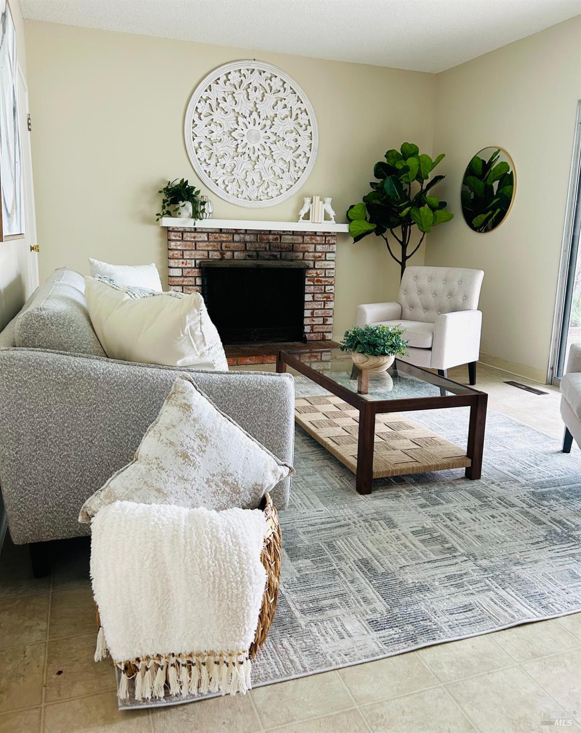 17884 Riverside Drive Sonoma, CA 95476 - Photo 11 of 20 a living room with furniture and a fireplace