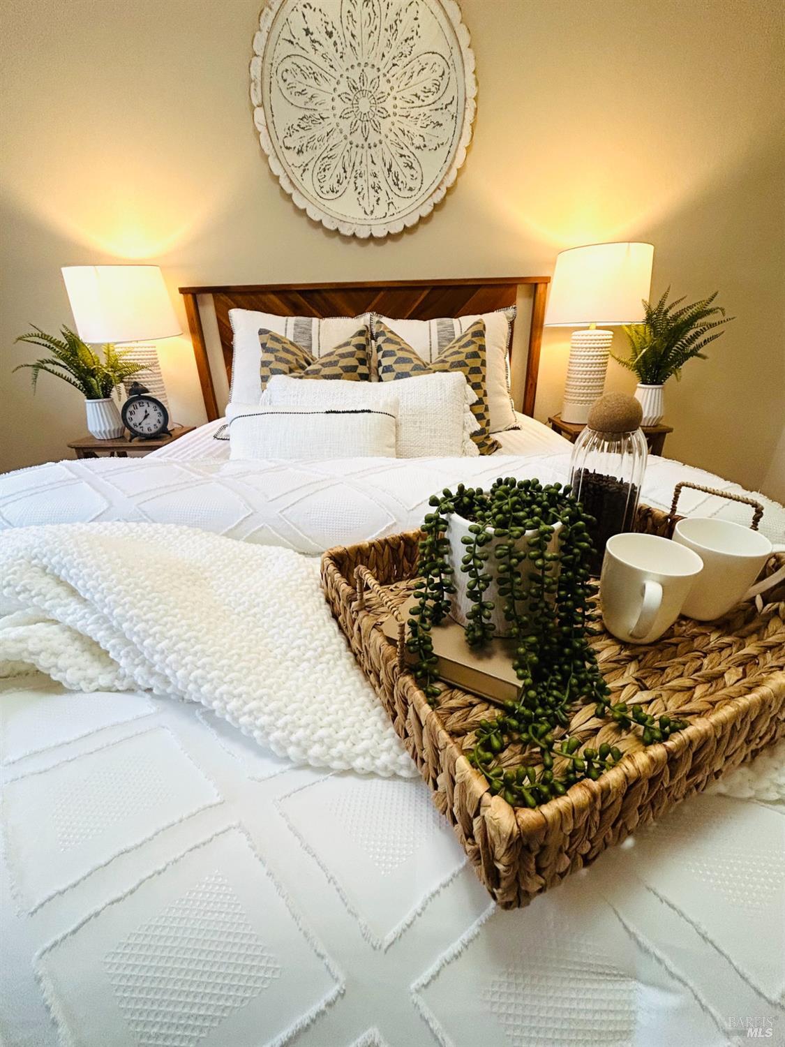 17884 Riverside Drive Sonoma, CA 95476 - Photo 12 of 20 a bed sitting in a bedroom next to a lamp