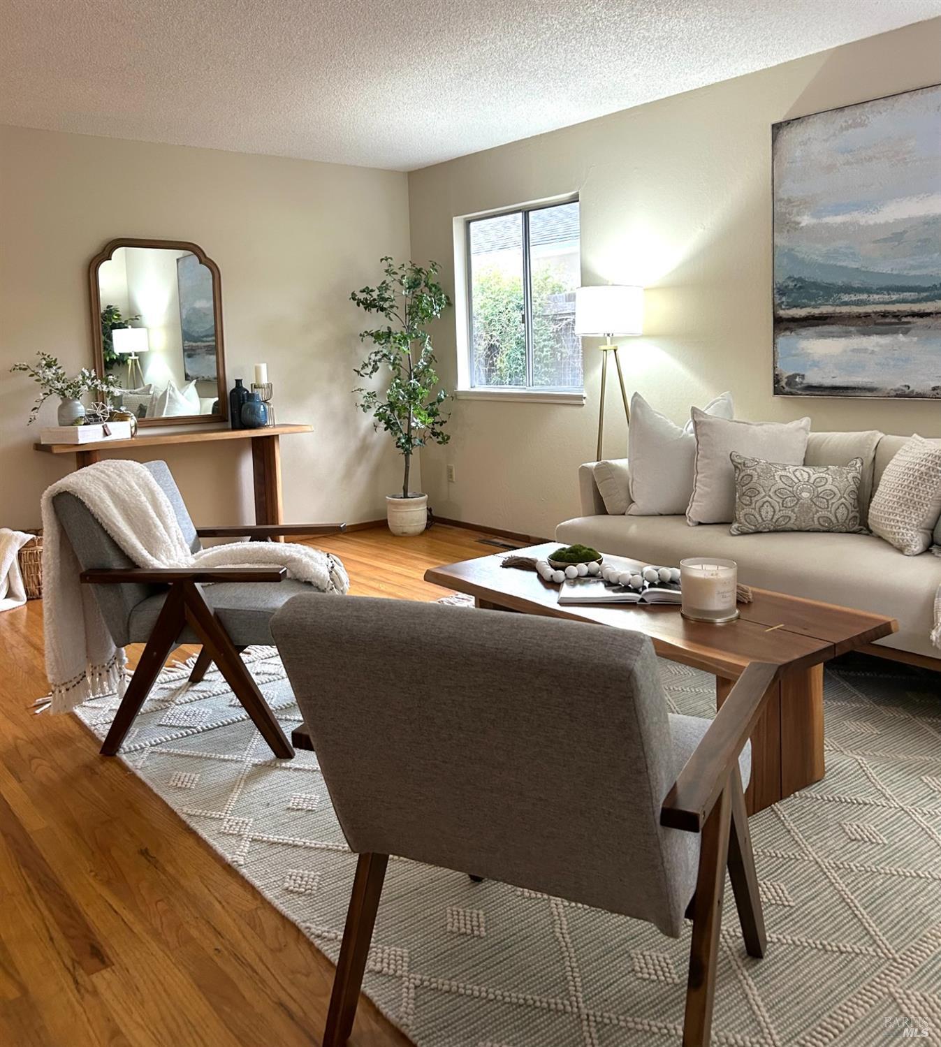 17884 Riverside Drive Sonoma, CA 95476 - Photo 3 of 20 a living room with furniture and a potted plant