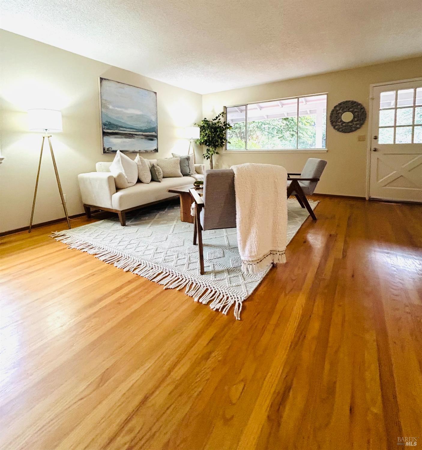 17884 Riverside Drive Sonoma, CA 95476 - Photo 5 of 20 a living room with furniture and a large window