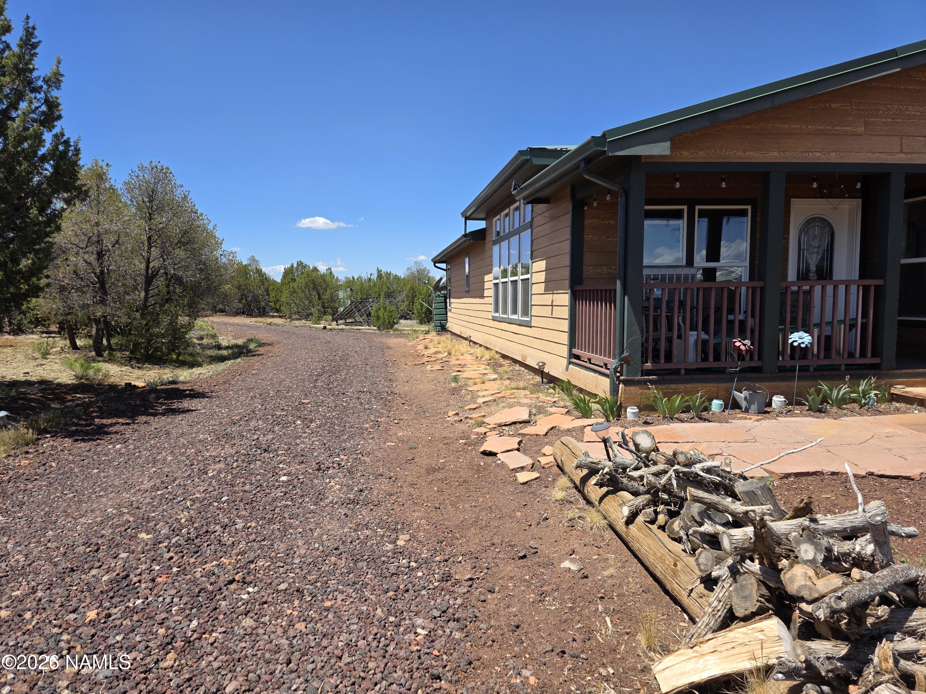 1431 East Cedar Road Williams, AZ 86046 - Photo 7 of 51 a view of a house with a yard