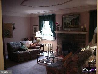 2310 Boyd Road Huntingdon Valley, PA 19006 - Photo 5 of 6 a living room with furniture and a fireplace