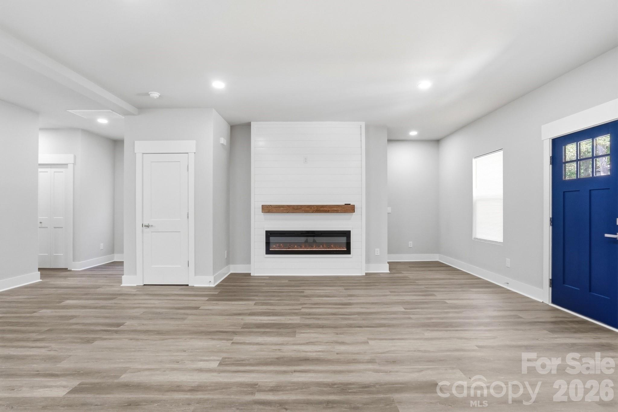 208 Wylie Park Road Lancaster, SC 29720 - Photo 11 of 48 a view of empty room with wooden floor and window