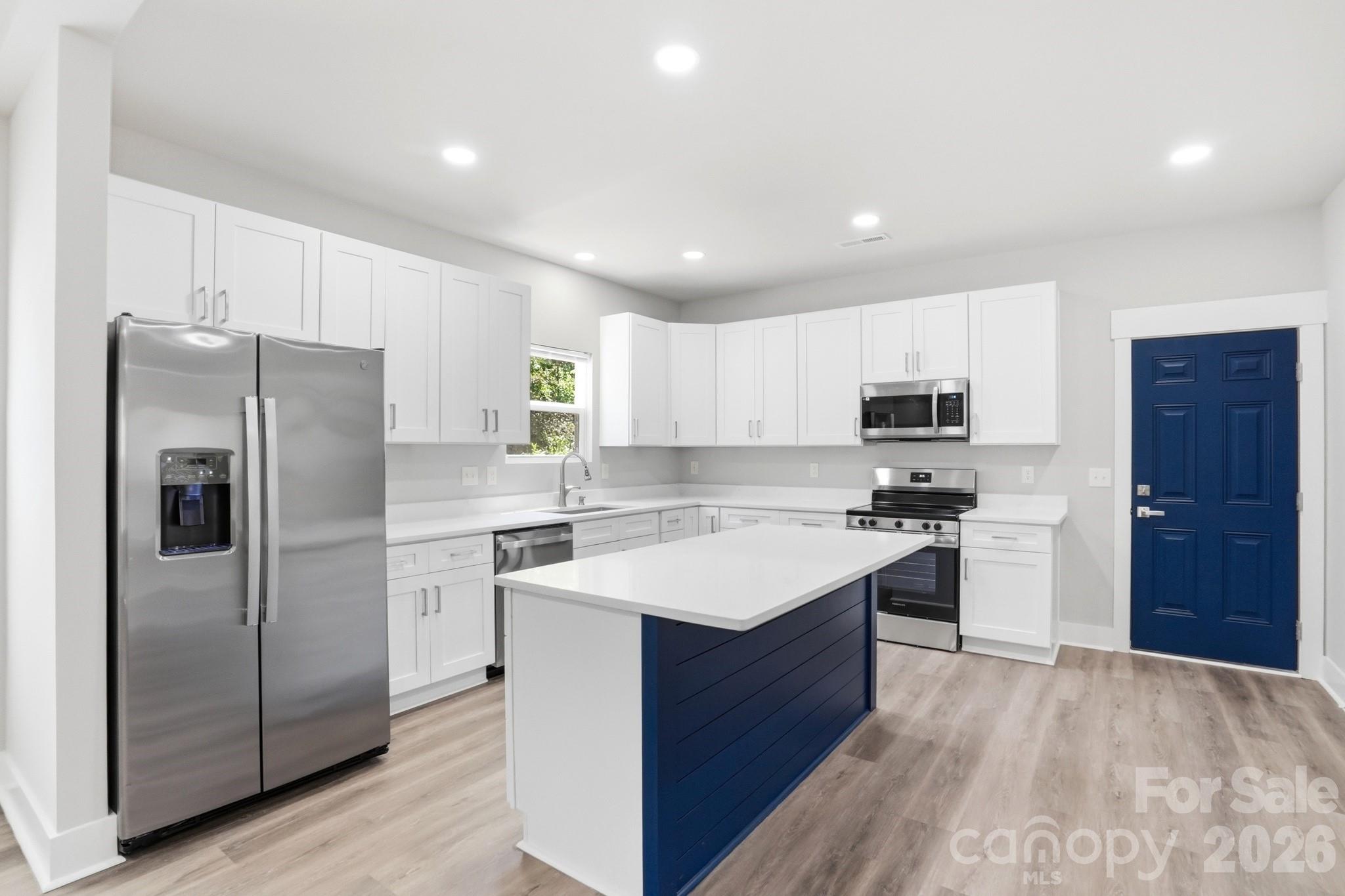 208 Wylie Park Road Lancaster, SC 29720 - Photo 15 of 48 a kitchen with stainless steel appliances a refrigerator stove microwave and sink