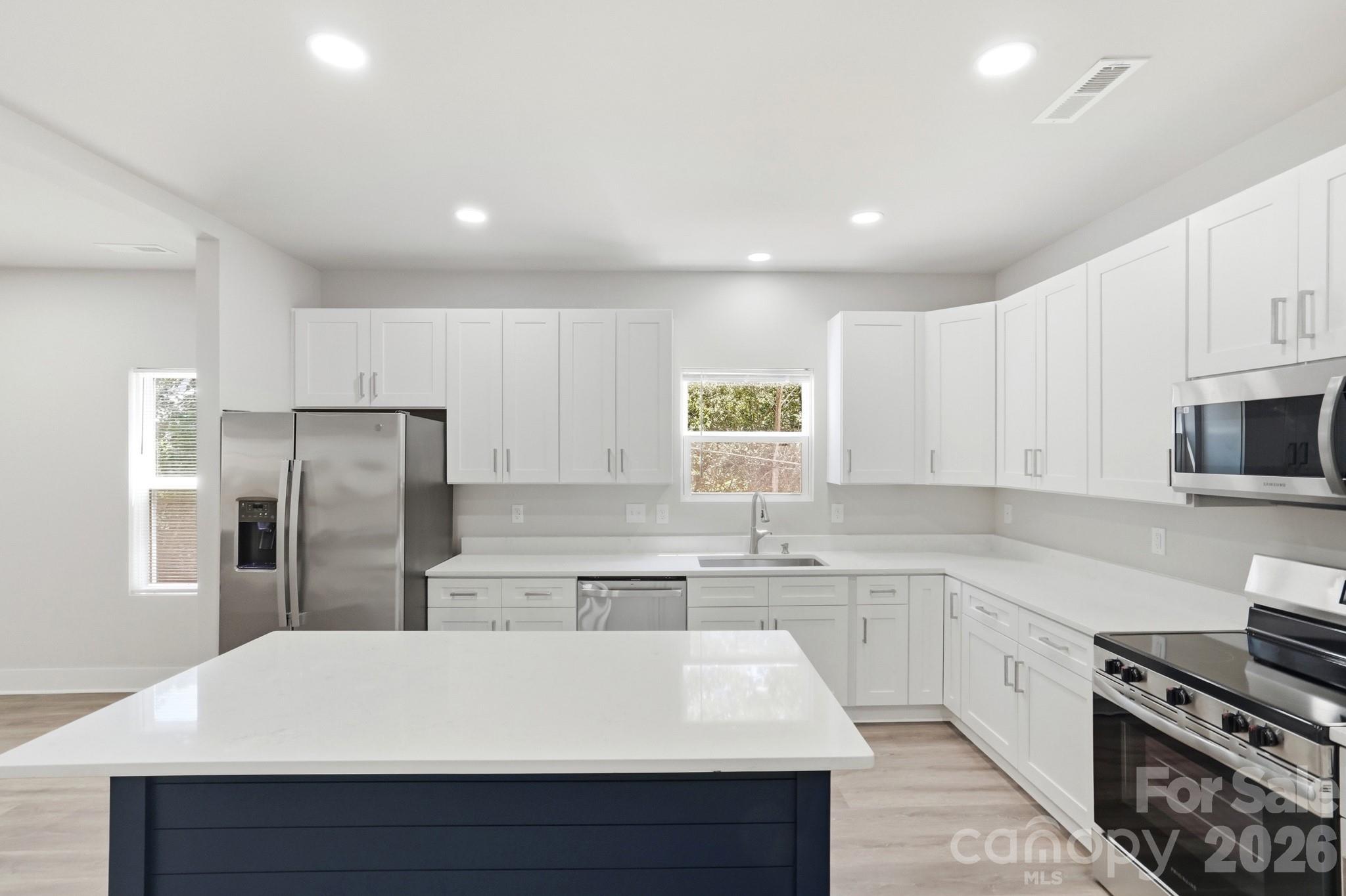 208 Wylie Park Road Lancaster, SC 29720 - Photo 16 of 48 a kitchen with stainless steel appliances a refrigerator sink and cabinets
