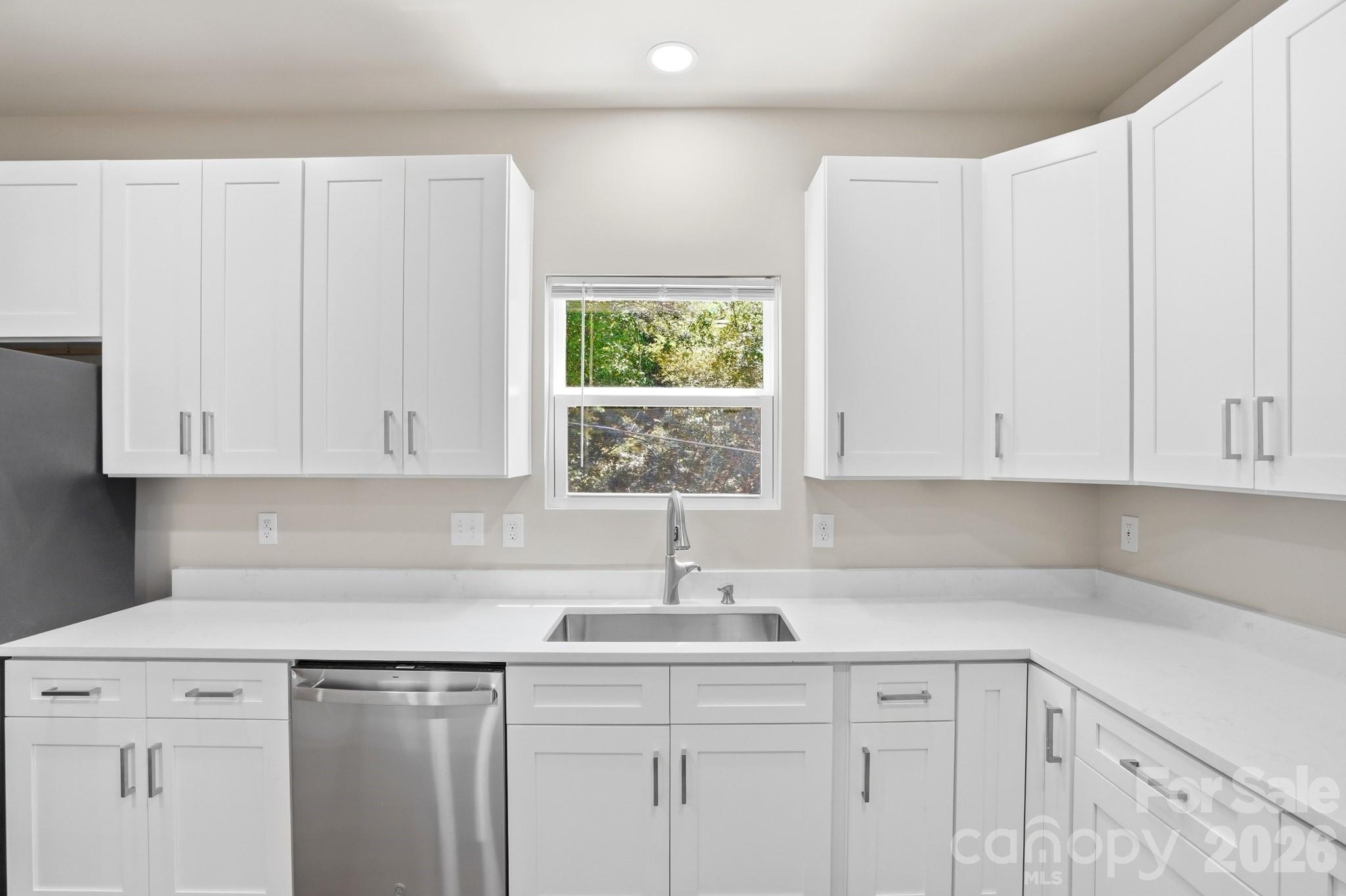 208 Wylie Park Road Lancaster, SC 29720 - Photo 18 of 48 a kitchen with a sink cabinets and window