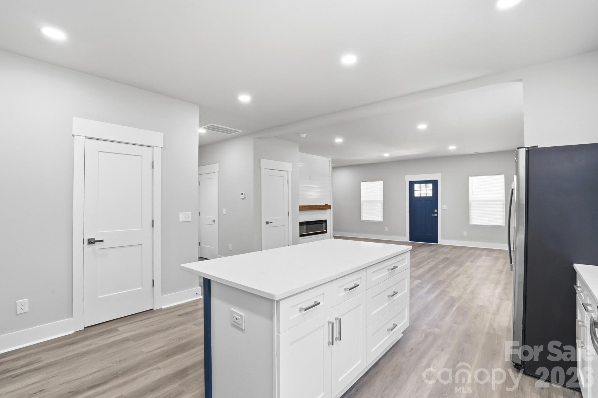 208 Wylie Park Road Lancaster, SC 29720 - Photo 20 of 48 a large kitchen with a refrigerator a sink and wooden floor