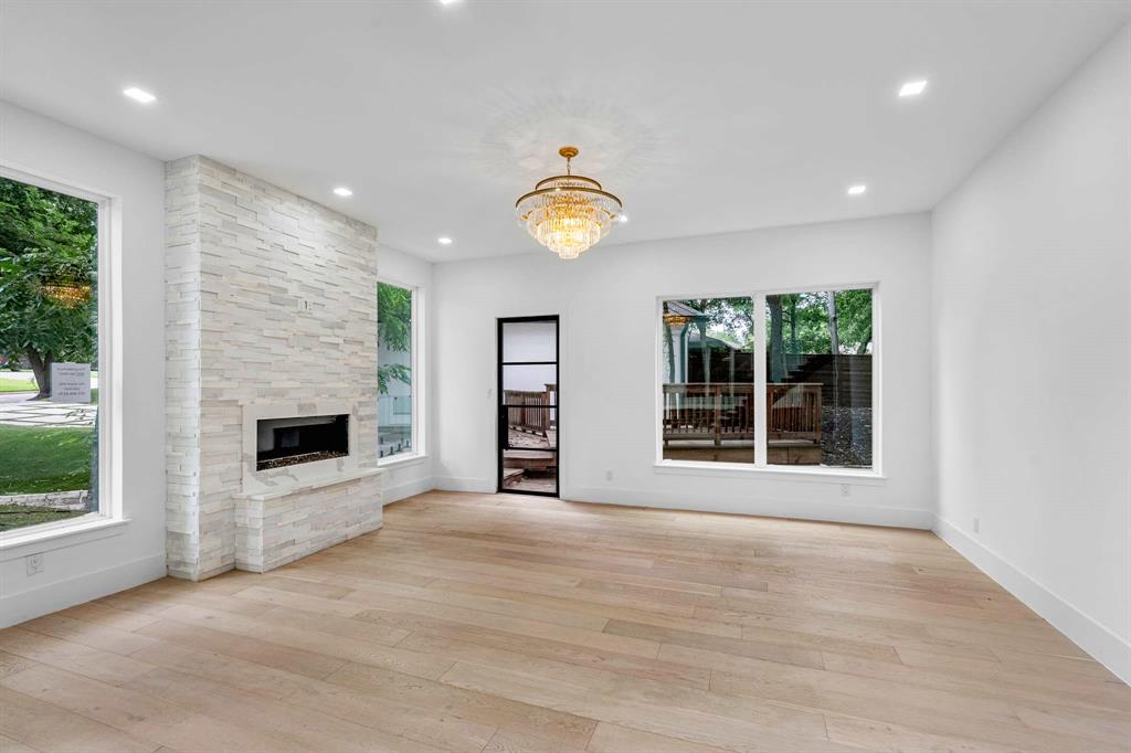 13032 Copenhill Road Dallas, TX 75240 - Photo 13 of 40 a view of a livingroom with a fireplace and window