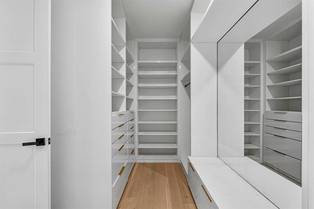 13032 Copenhill Road Dallas, TX 75240 - Photo 20 of 40 a view of walk in closet with empty racks