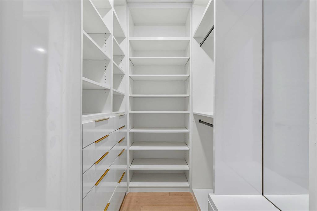 13032 Copenhill Road Dallas, TX 75240 - Photo 21 of 40 a view of walk in closet with empty racks