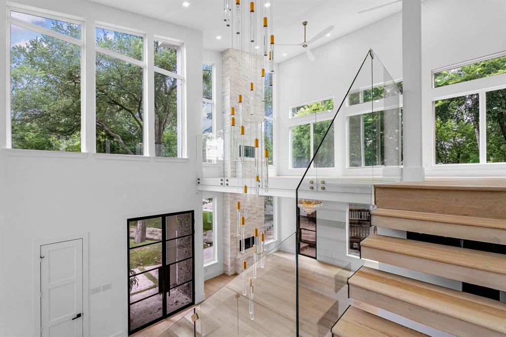 13032 Copenhill Road Dallas, TX 75240 - Photo 23 of 40 a living room with furniture a window and a fireplace